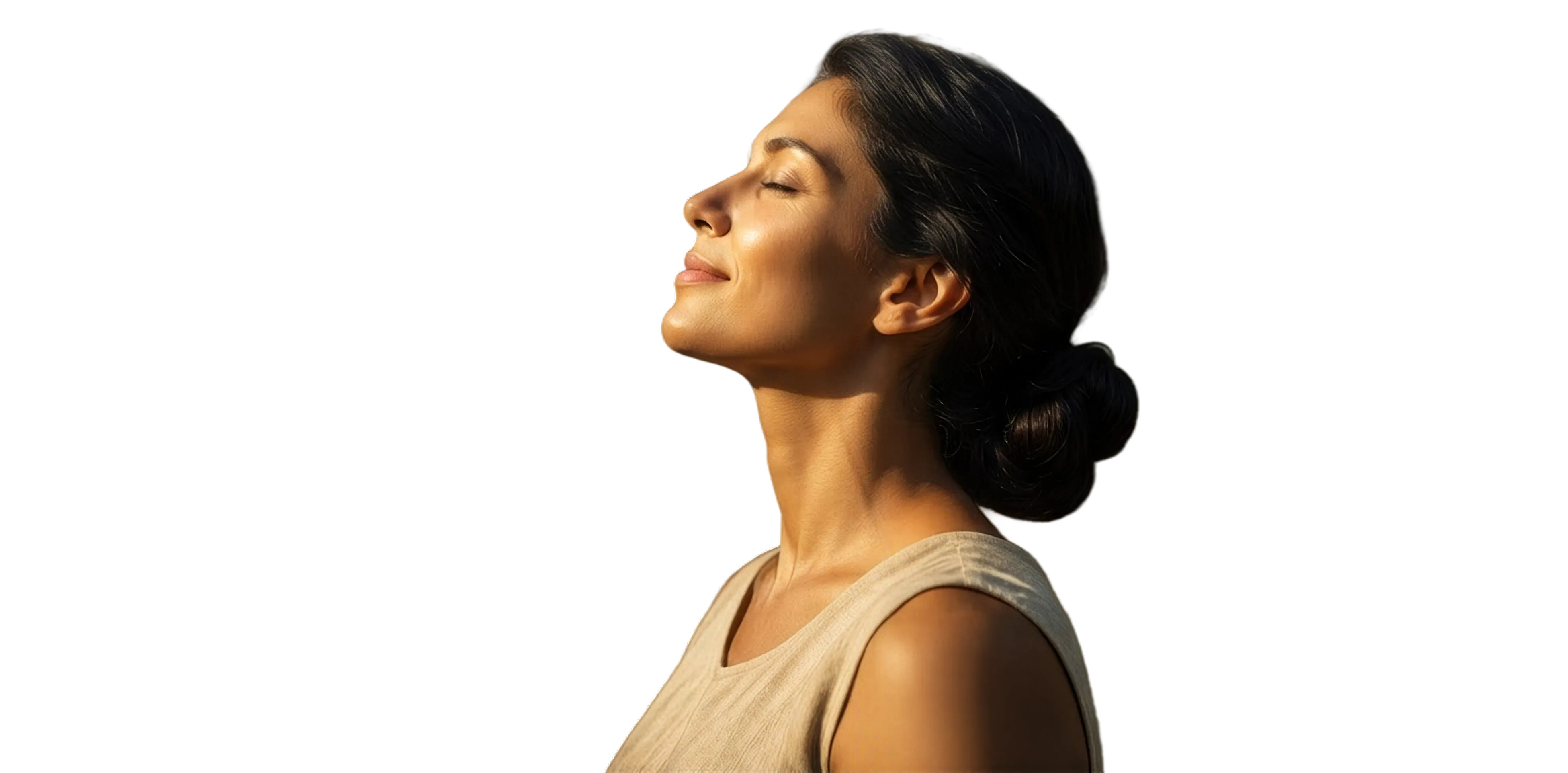 A woman with her eyes closed, face turned toward the sun